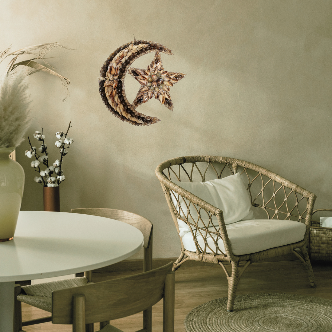 Rattan chair with white cushion and decorative wall art in a room setting.