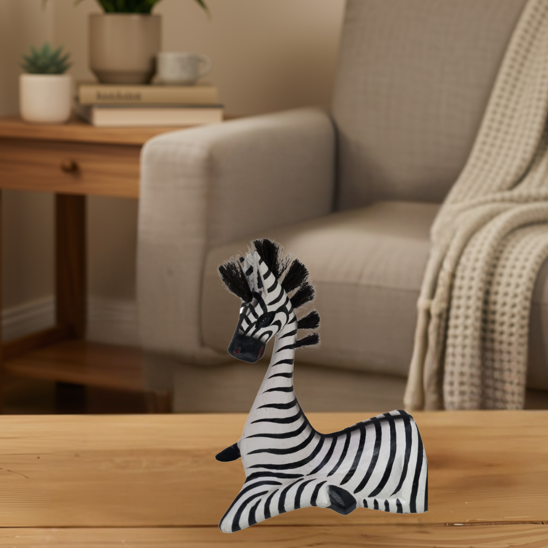 Sitting Zebra Statues Wooden Designs Small white and black striped wooden figurine sitting on a timber table in a neutral living room