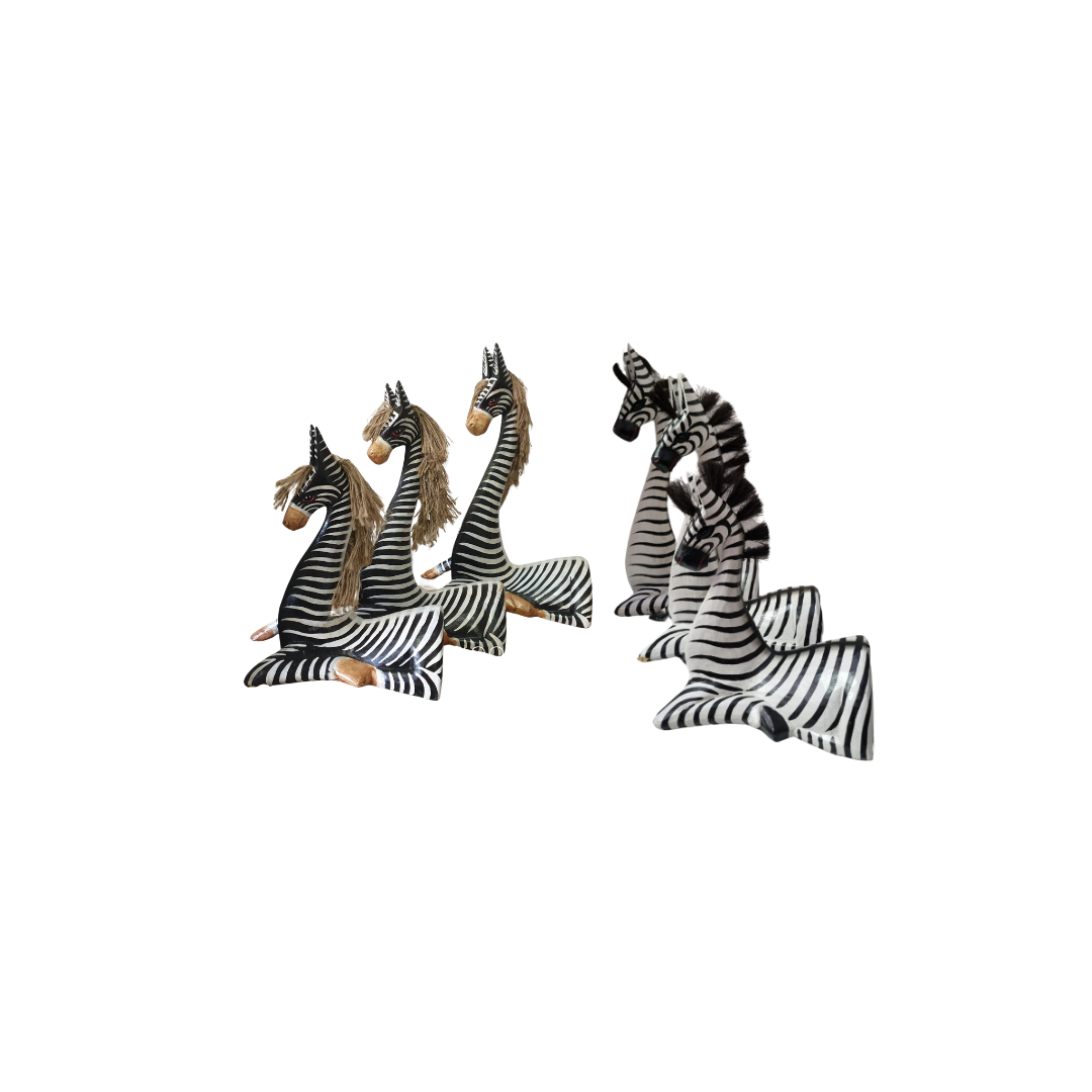 wooden zebra statues, 2 sets each set has one set with beige mane the other black mane both resting on a white back ground