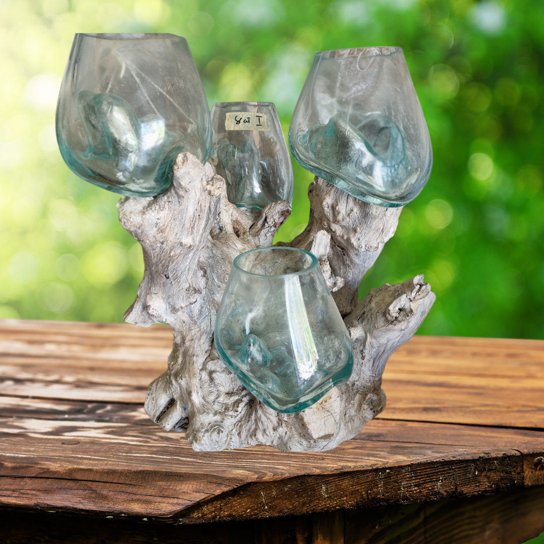 Decorative candle holder with glass candles on a wooden surface