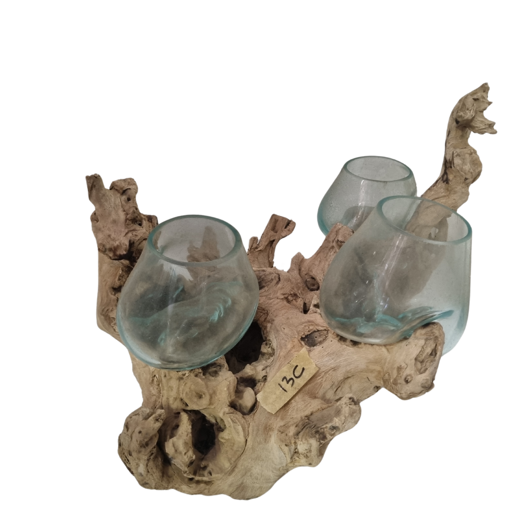 Driftwood holder with three glass cups on a white background