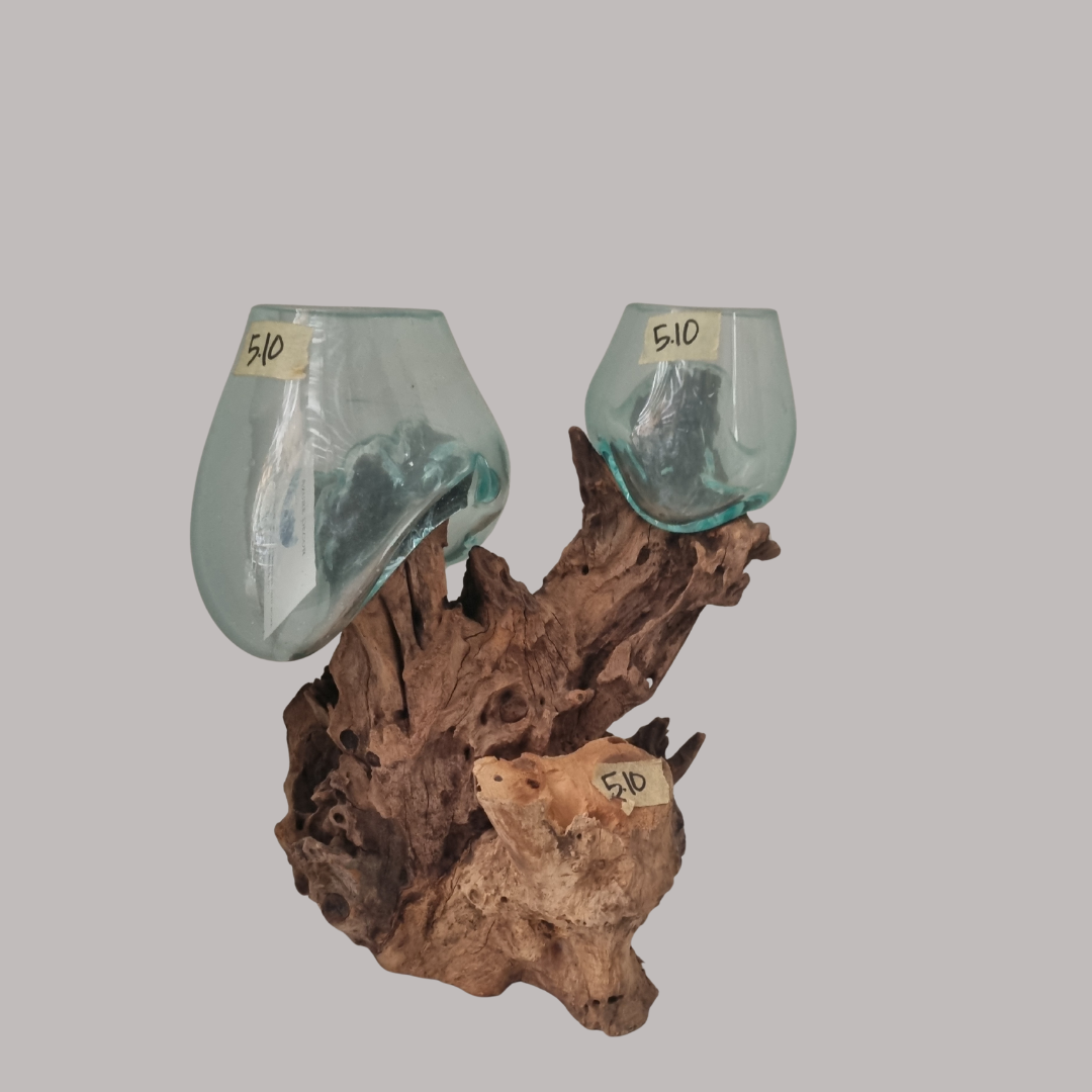 Decorative wall sconce with glass shades and wooden base on a gray background