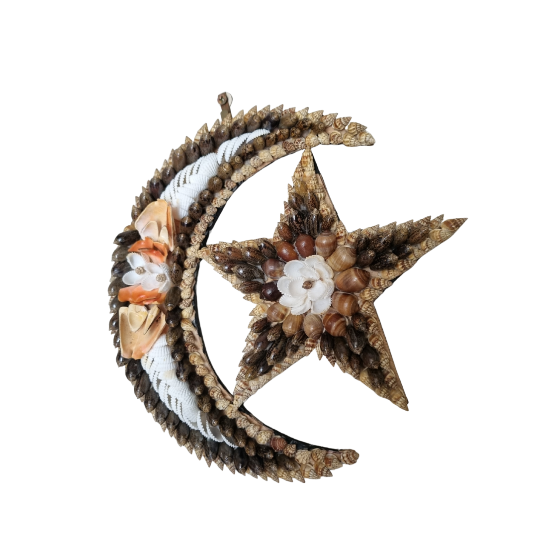 Decorative wall art with a star and moon design on a white background