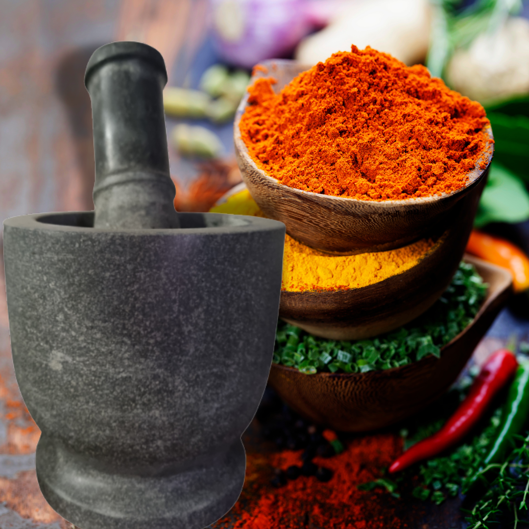 Mortar and pestle with colorful spices and fresh herbs on a rustic background