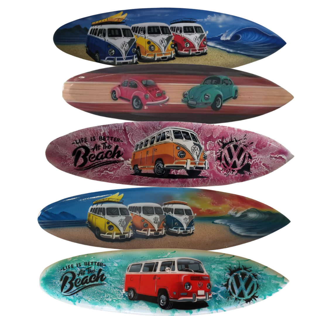 Collection of surfboards with Volkswagen bus designs on a white background
