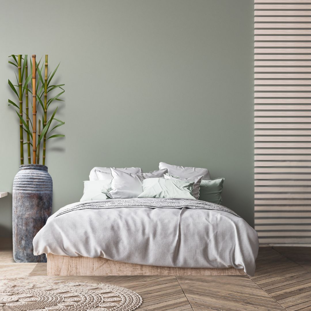 Tall rustic textured floor vase in aged charcoal and blue-grey tones styled beside a bed with bamboo stems in a serene spa-inspired bedroom — handcrafted decorative floor vase by Azure Decor