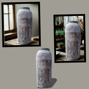 Three rustic vases on a gray background with reflections of indoor scenes.
