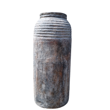 A tall cylindrical rustic pot suitable for indoor or outdoor use, finished in brown and gray tones with a ribbed texture.