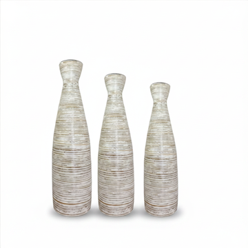 Three textured vases of varying heights on a white background