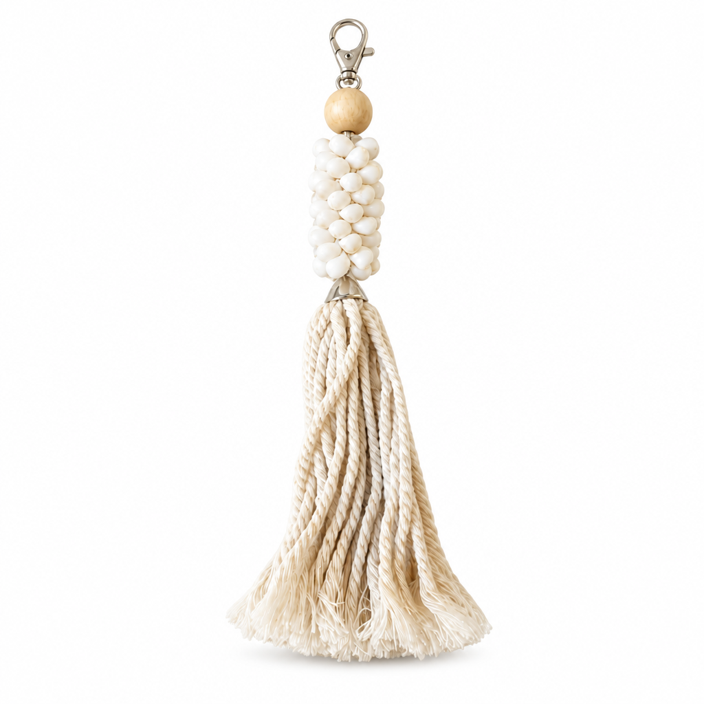 Natural on white: Cream strands, a light wood bead, pale bead cluster and silver-tone clip against