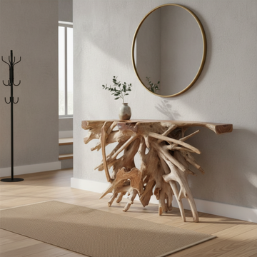 Teak root wood console table styled in a modern hallway — sculptural branching root base, natural live-edge teak top, ceramic vase with eucalyptus stems, round gold mirror above, coat stand, jute rug, bleached timber flooring and soft natural light