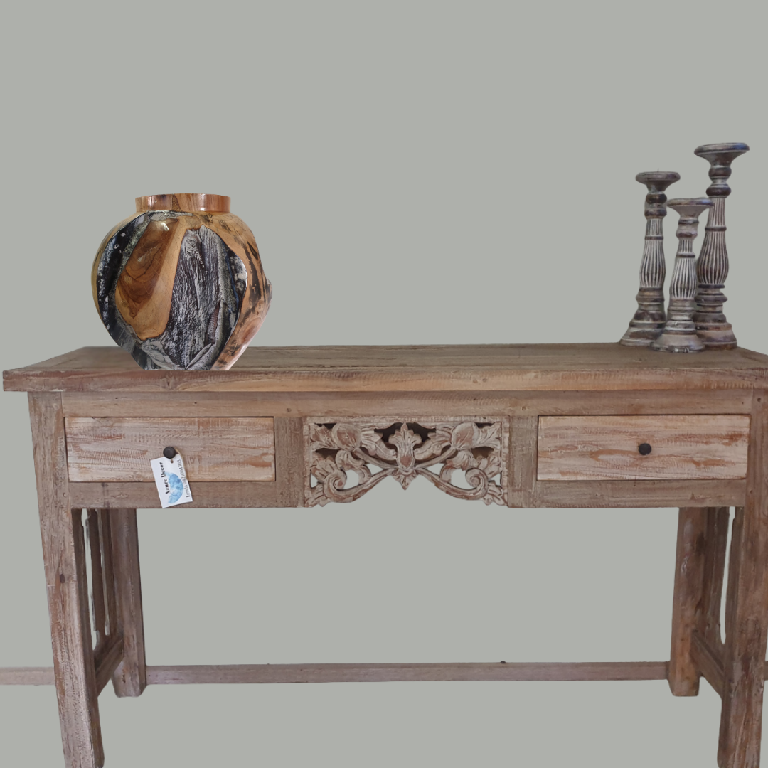 Wooden console table with decorative items on a plain background
