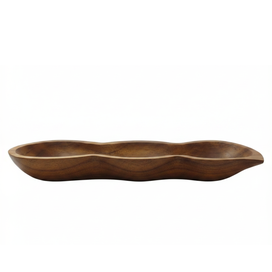 Wooden serving dish with wavy edges on a white background
