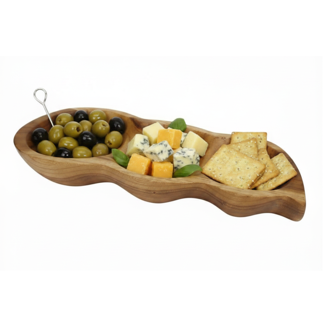 Kitchen lifestyle — olives, cheese, crackers in the three sections: "Teak Wood Serving Tray Pod styled with olives, cheese and crackers on a timber kitchen bench