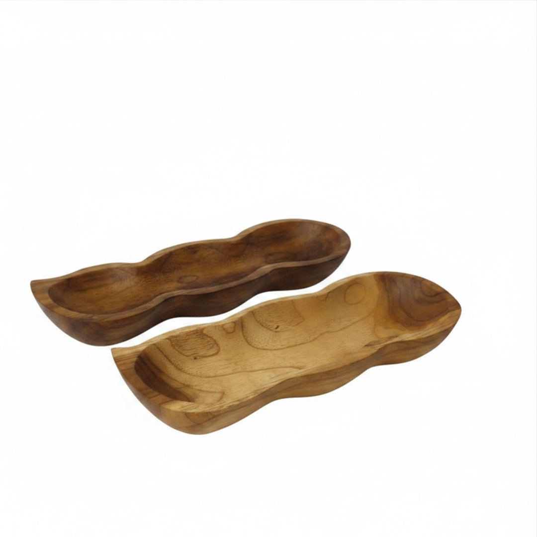 Two trays stacked — top and underside view: "Two teak wood pod trays showing the carved interior and natural wood grain underside on a white background