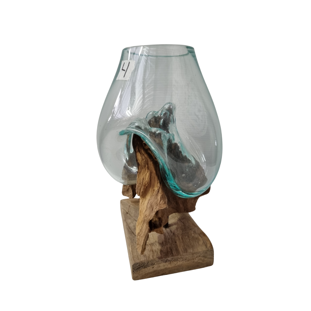 Handblown glass vessel on a natural driftwood root with flat rectangular timber base, three-quarter view