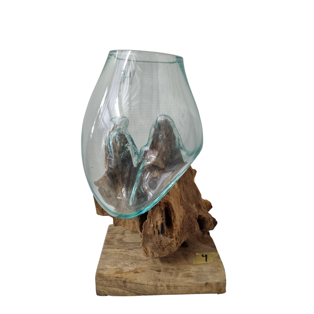 Handblown glass vessel on a natural driftwood root with flat rectangular timber base, three-quarter view
