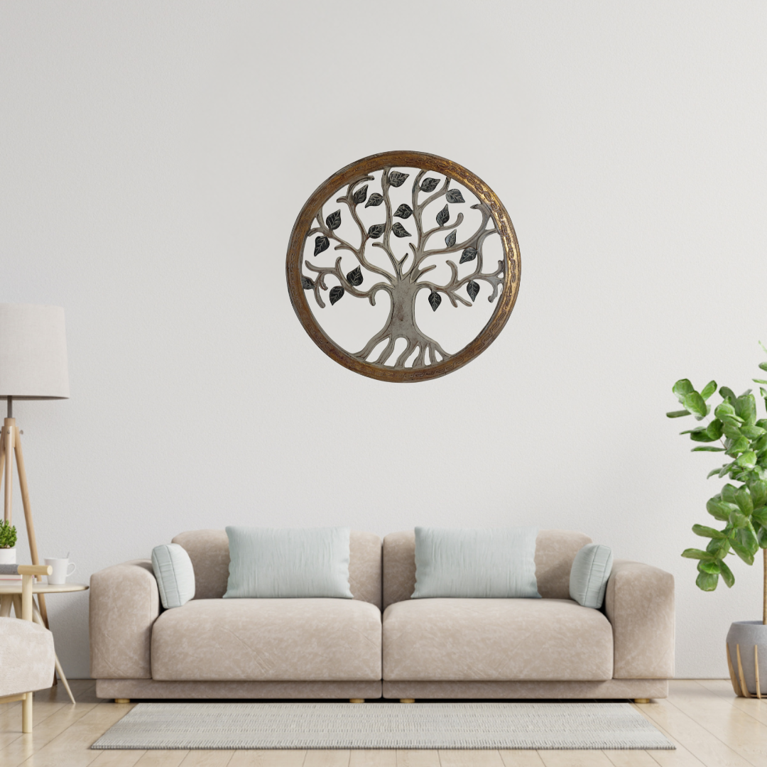 Decorative wall art of a tree with leaves above a beige sofa in a living room.