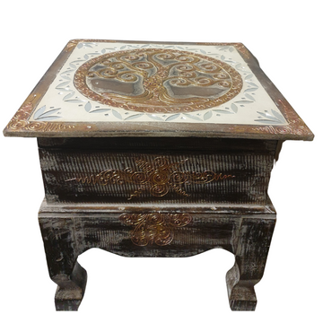Angled view of distressed dark wood with a gold-toned branching motif, mirrored mosaic lid, decorative scrollwork and curved legs.