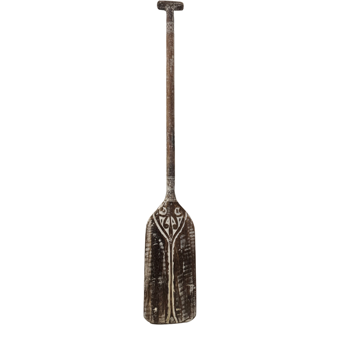 natural wooden paddle decorative wall art on a white back wall
