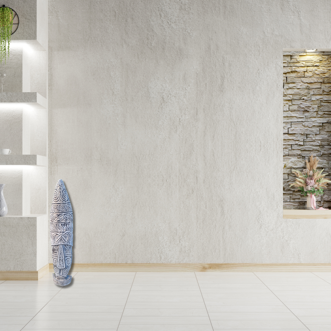 tribal mask statue in the front of a Textured wall with decorative elements in a room setting
