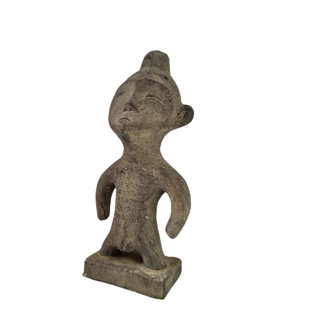 Tribal stone statue inspired by ancient Sulawesi figures displayed on 