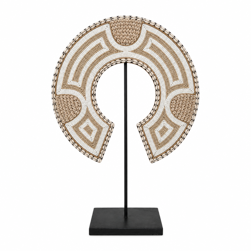Medium crescent-shaped shell and bead decoration on a black metal stand against a white background