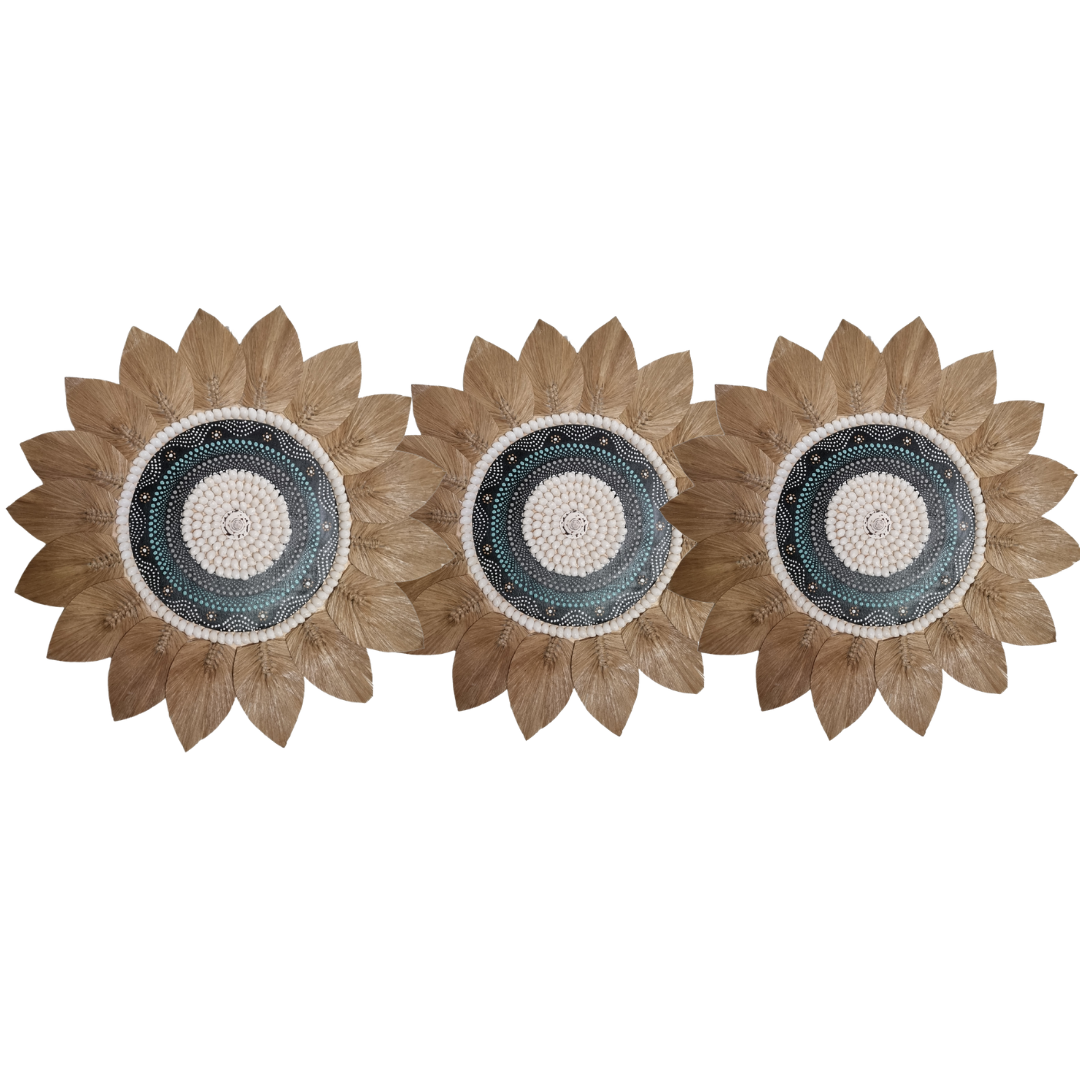 Three sunflower-shaped decorative items with a central circular design on a white background