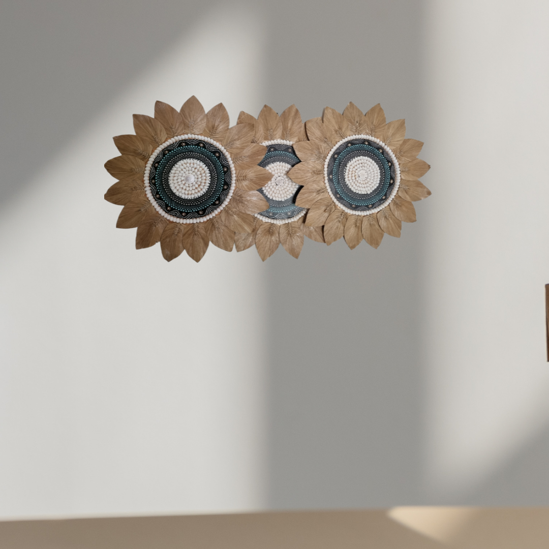 Three Tropical style shell and seagrass wall decoration with painted centrepiece