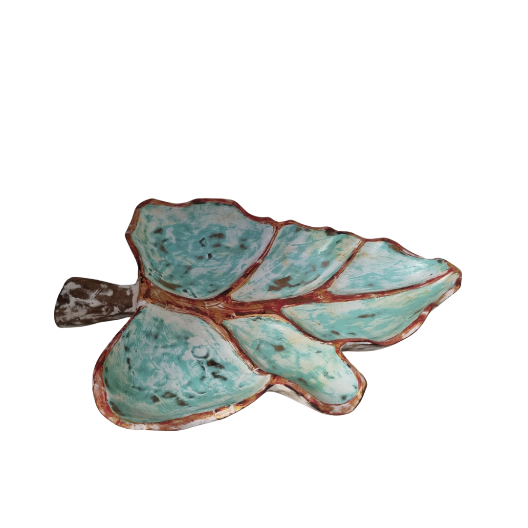 Handcrafted solid teak wood leaf dish with turquoise glaze, brown vein and edge detail and natural stem — top-down angle on white background