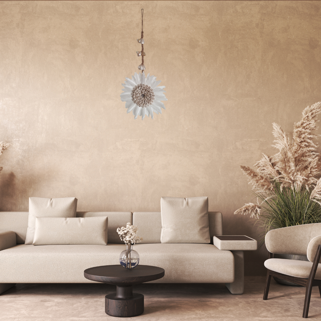 Modern living room with beige sofa, round coffee table, and decorative elements.