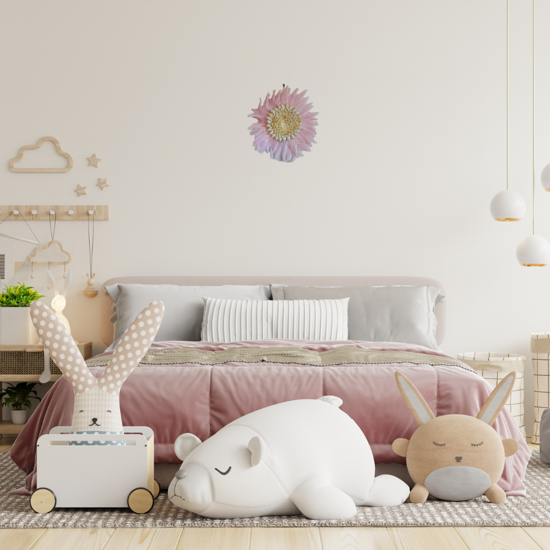 Children's bedroom with plush toys and decorative elements on a bed.