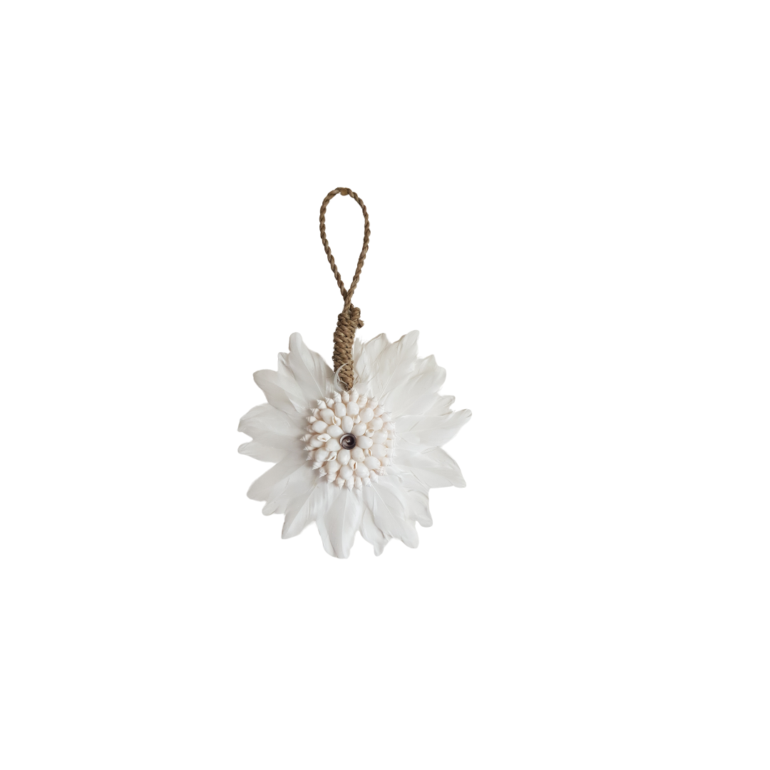 White floral ornament with a brown string on a white background