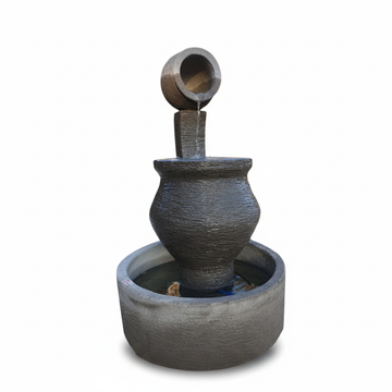 A rustic style concrete water fountain style pot of tranquility 