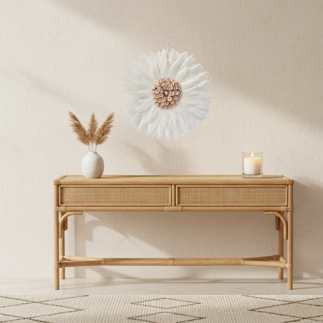 Rattan console table with decorative items against a beige wall
