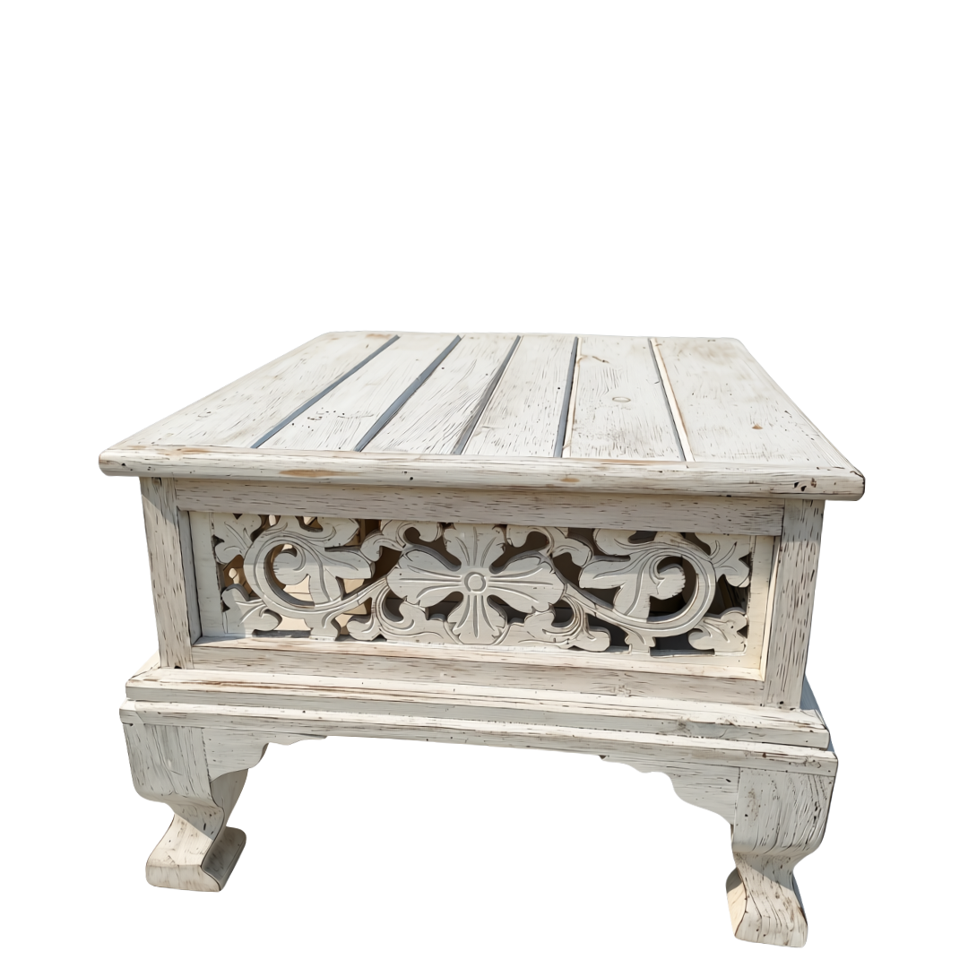 Square low-profile wooden coffee table with distressed white finish and intricate floral carvings on the front panel, isolated on white background