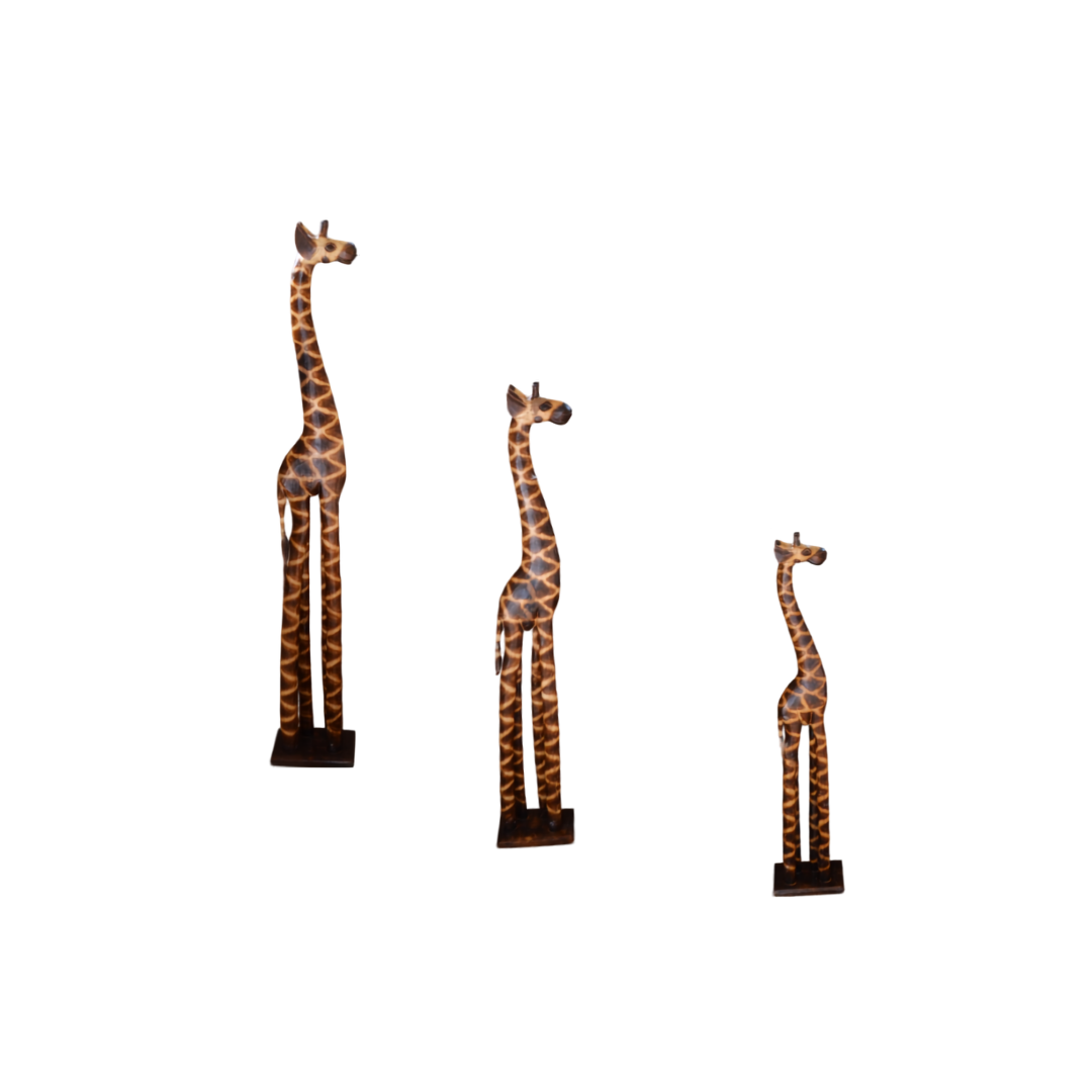 Three carved timber giraffe figurines in large, medium and small sizes facing sideways on square bases, white background