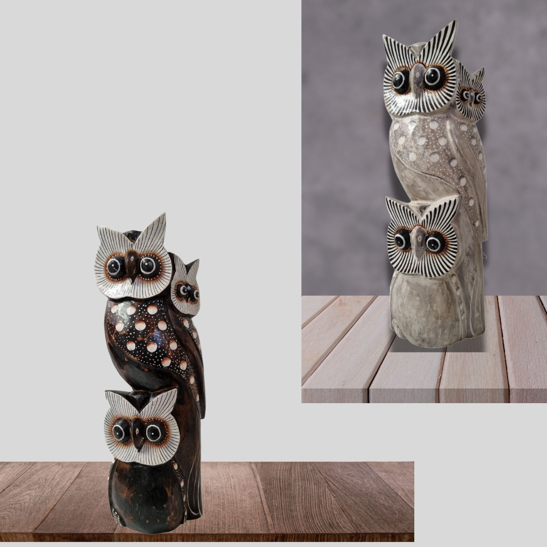 Set of owl-shaped decorative items on a wooden surface with a gray background.