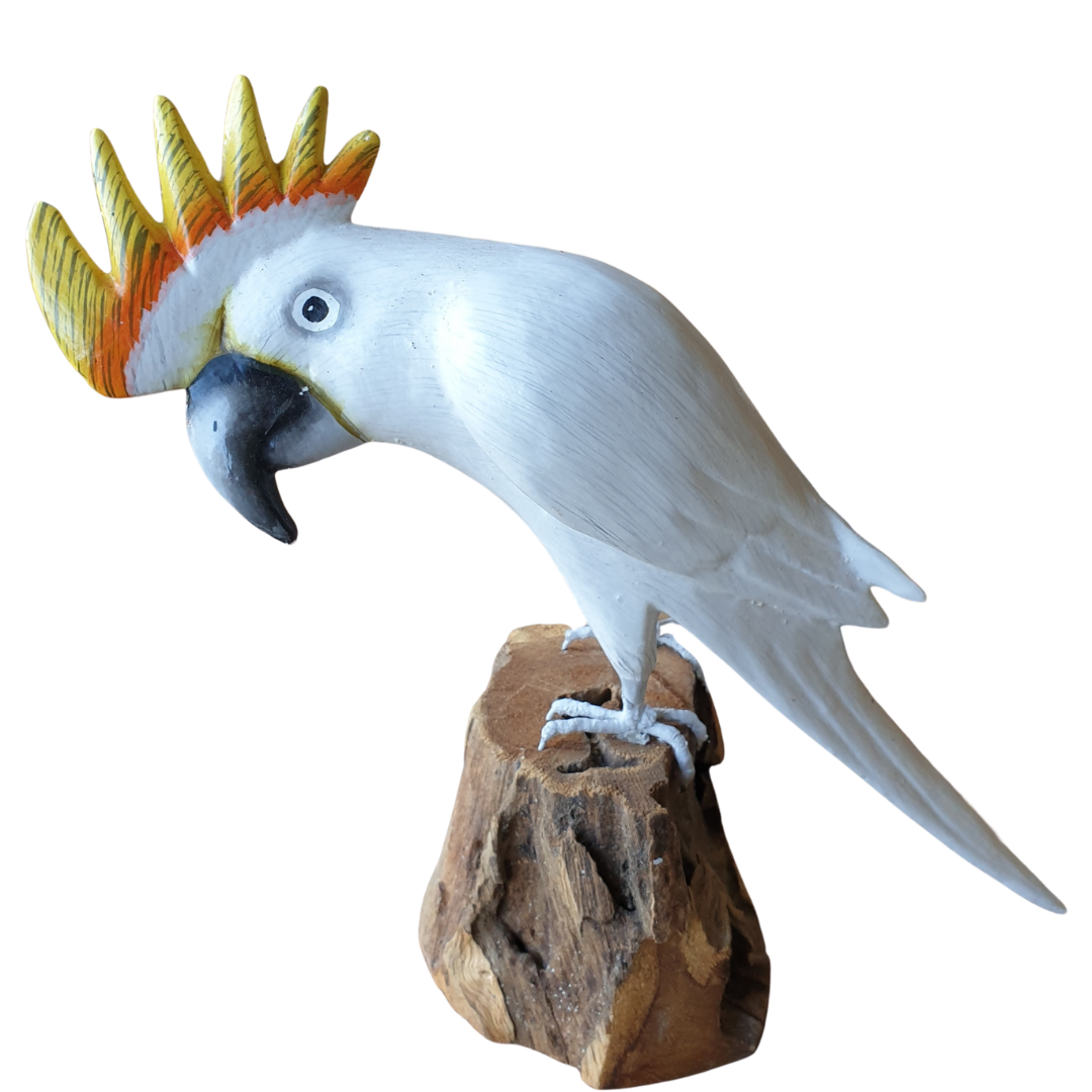 cockatoo figurine with a colorful crest on a wooden perch against a white background