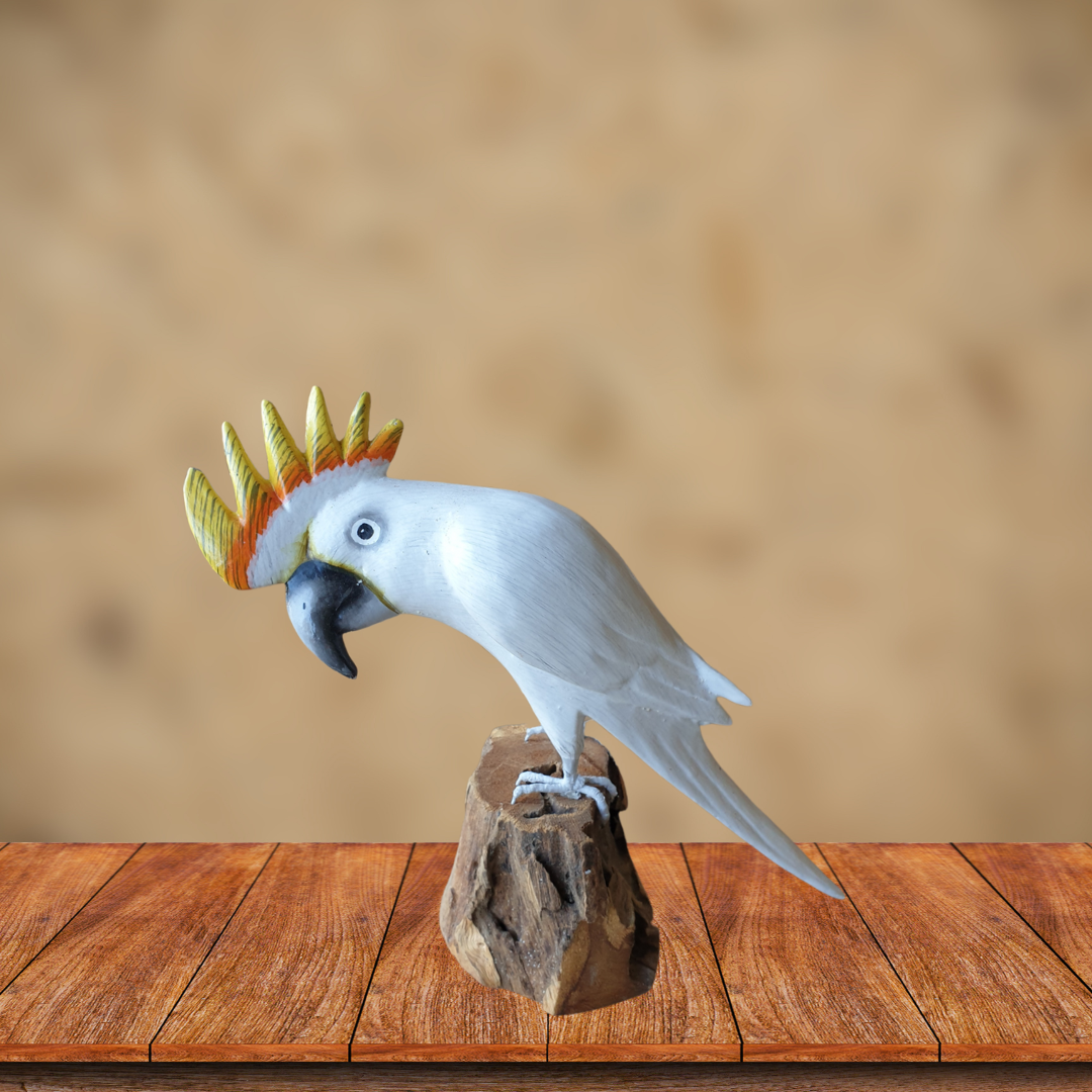 cockatoo figurine on a wooden platform with a blurred background
