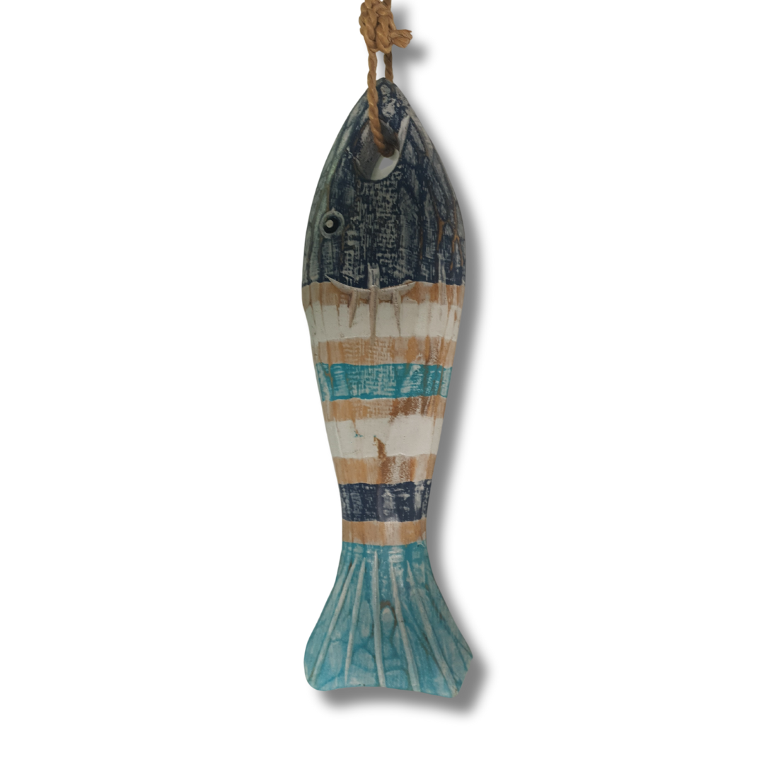 A rustic, fish-shaped hanging wall decor piece made from weathered wood, featuring painted stripes of teal blue, cream, and natural brown, suspended by a rope loop at the top.