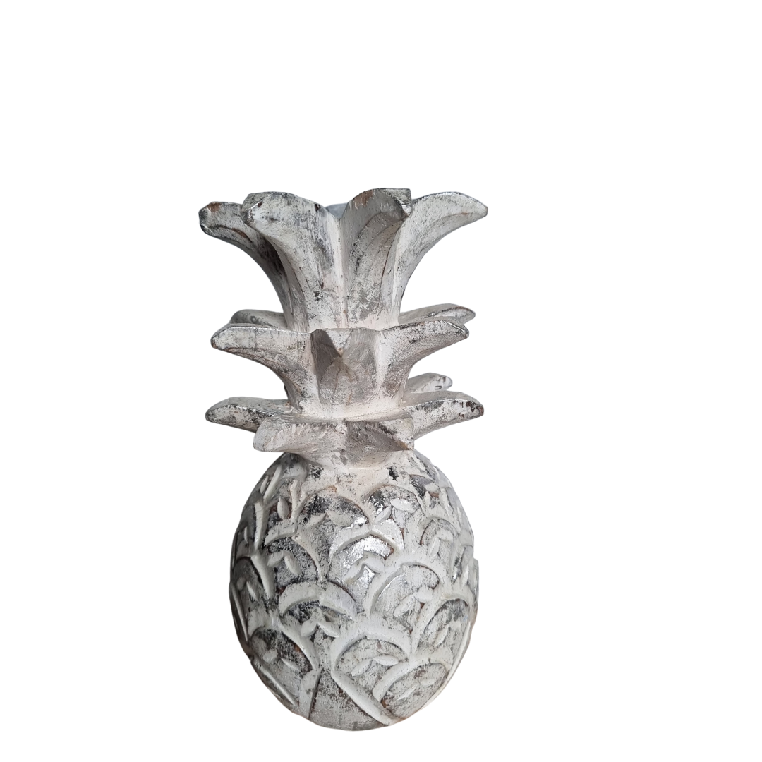 Decorative pineapple sculpture on a white background