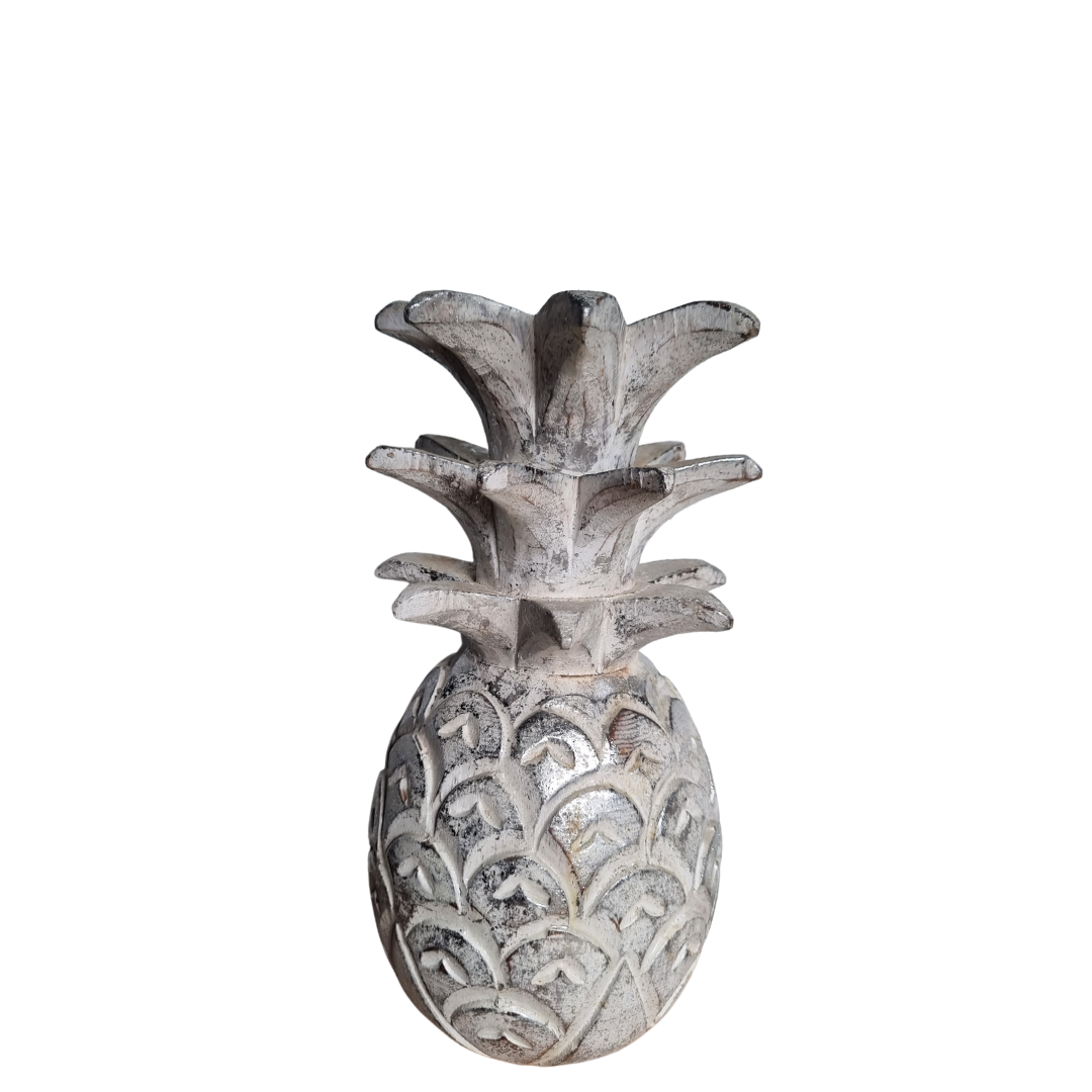 Decorative pineapple sculpture on a white background