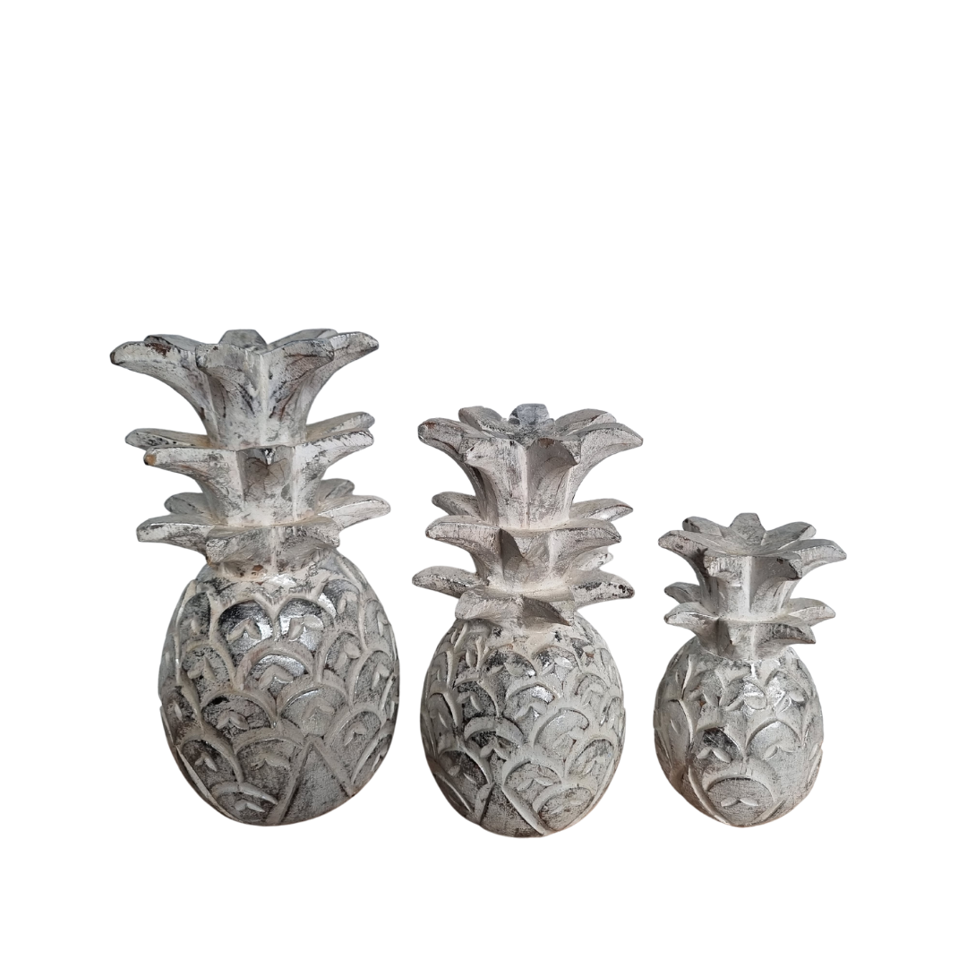 Set of three decorative pineapple-shaped  on a white background