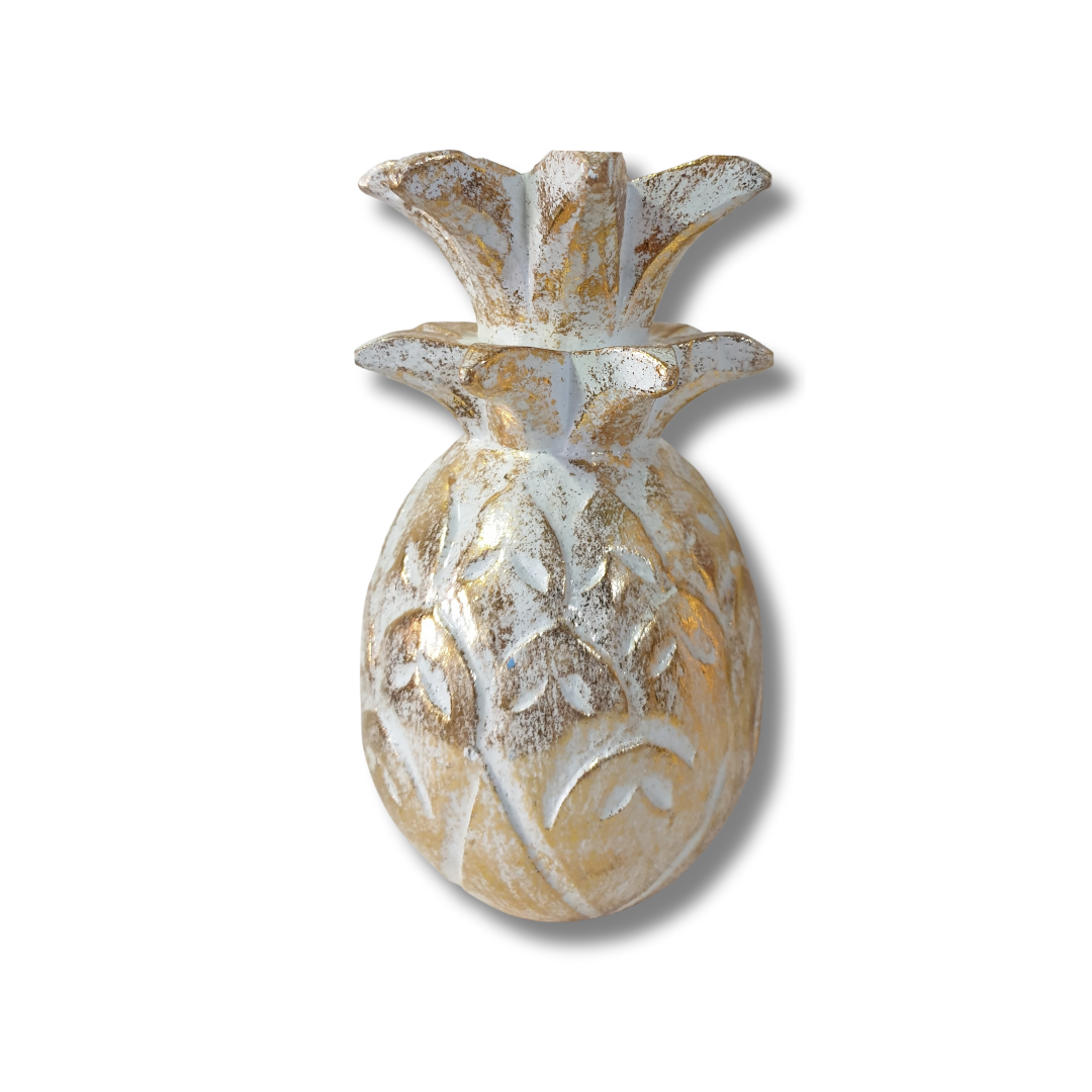 Decorative pineapple art with a textured finish on a white background