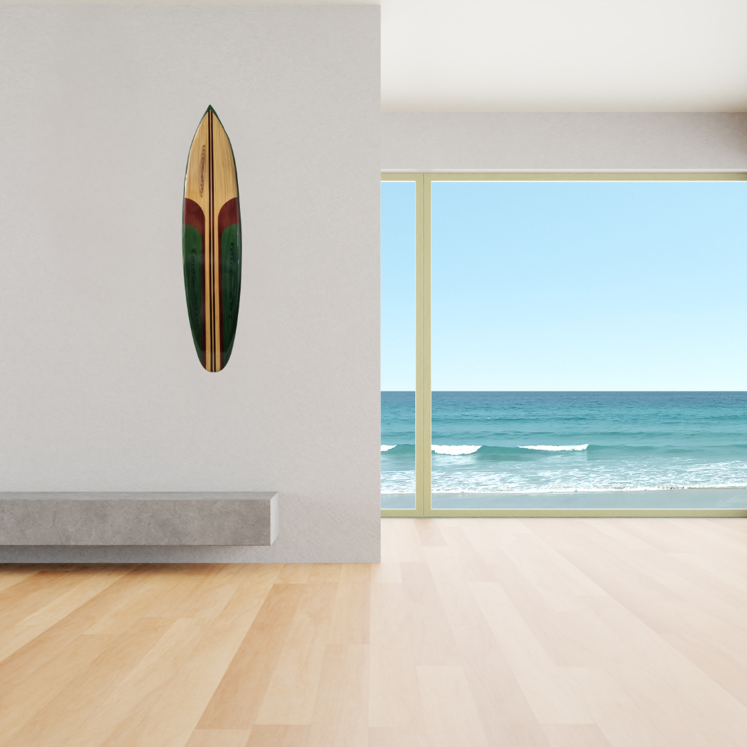 Wooden surfboard wall art in green hung on a white wall in a modern beachfront living room with ocean views – coastal wall decor | Azure Decor