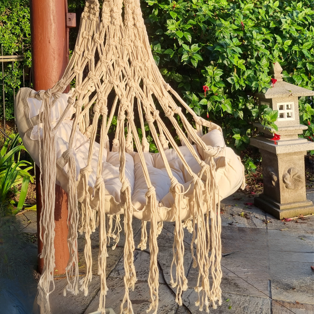 Garden setting area with a  hammocks by a poolside in a tropical setting