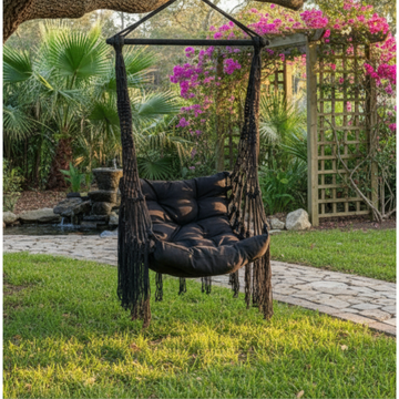 Black adult swing chair in black cotton in a garden setting 