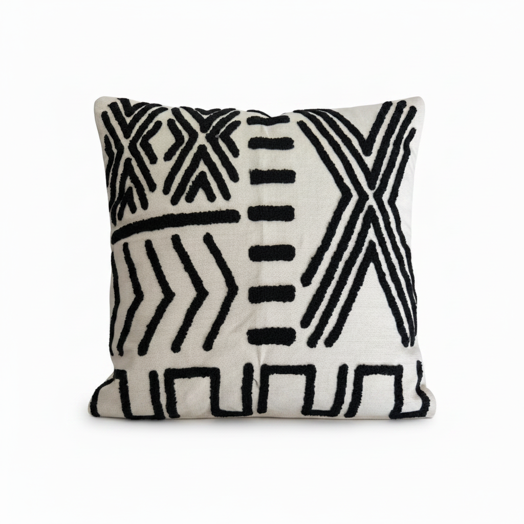 Bold black and white embroidered cushion styled 
