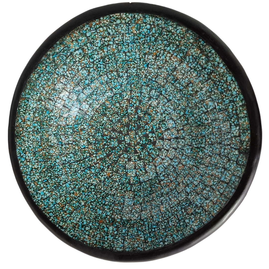 Turquoise mosaic tile decorative bowl with a dark rim, viewed from the front against a white background.